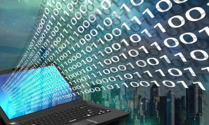 Laptop with binary code over cityscape background.