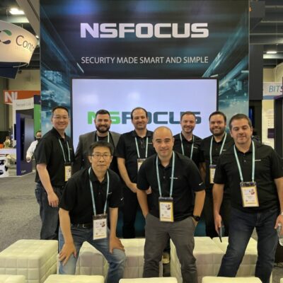 Team posing at NSFOCUS exhibition booth.