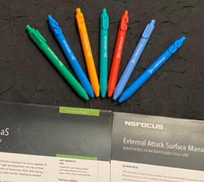 Colorful pens and NSFOCUS brochures on table.