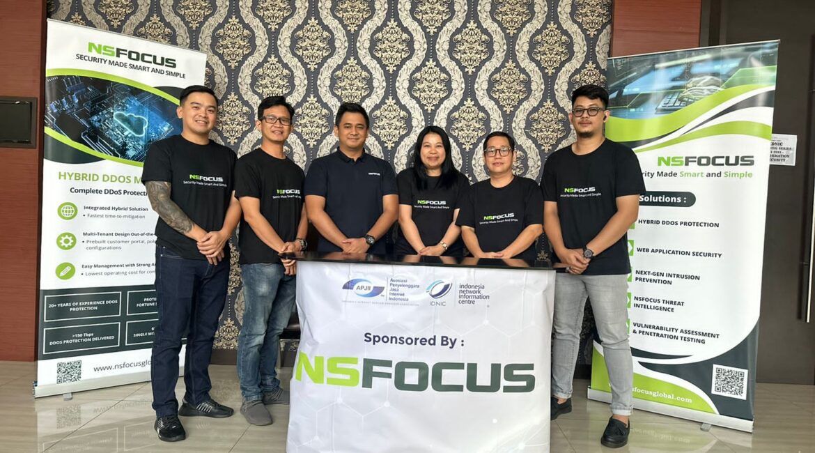 Team posing at NSFOCUS event booth.
