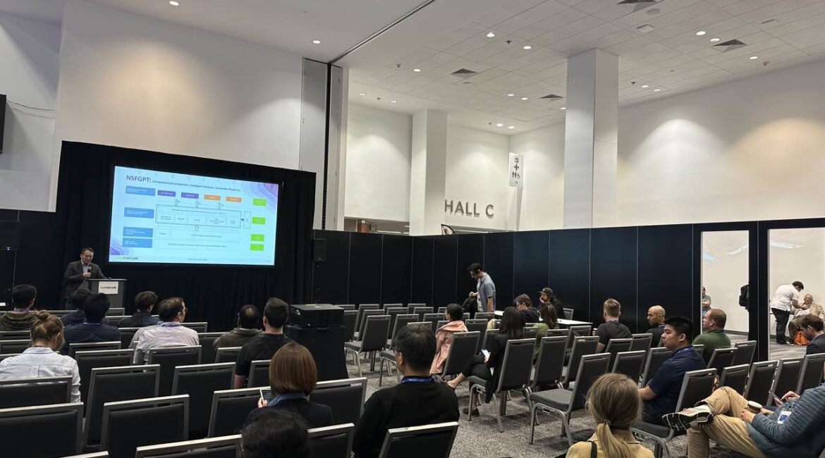 Conference presentation in Hall C with attendees.