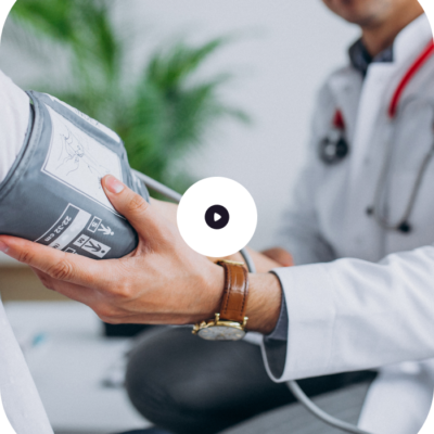 A doctor measuring a patient's blood pressure with a sphygmomanometer.